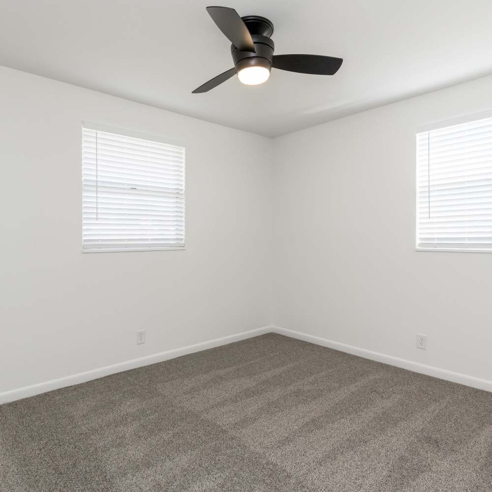 Windows in a bedroom with a ceiling fan at New Village At Hermitage in Hermitage, Tennessee