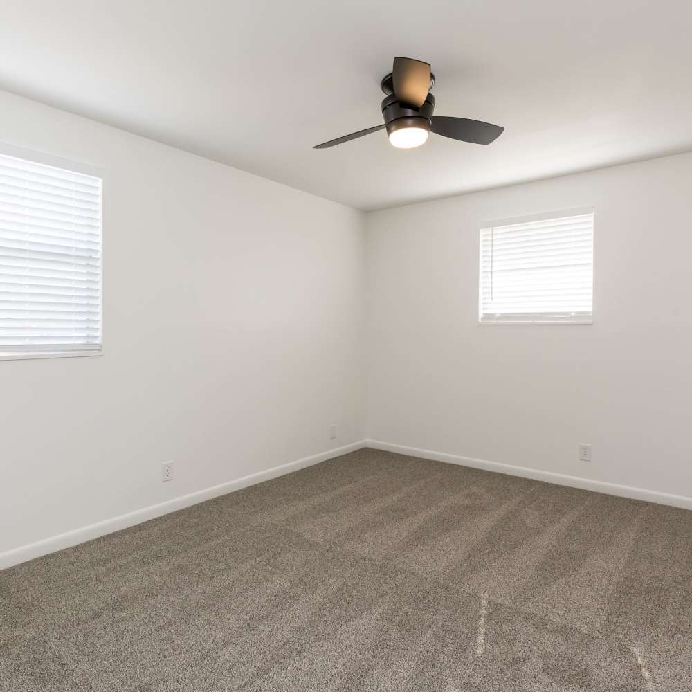 Bedroom with two windows at New Village At Hermitage in Hermitage, Tennessee