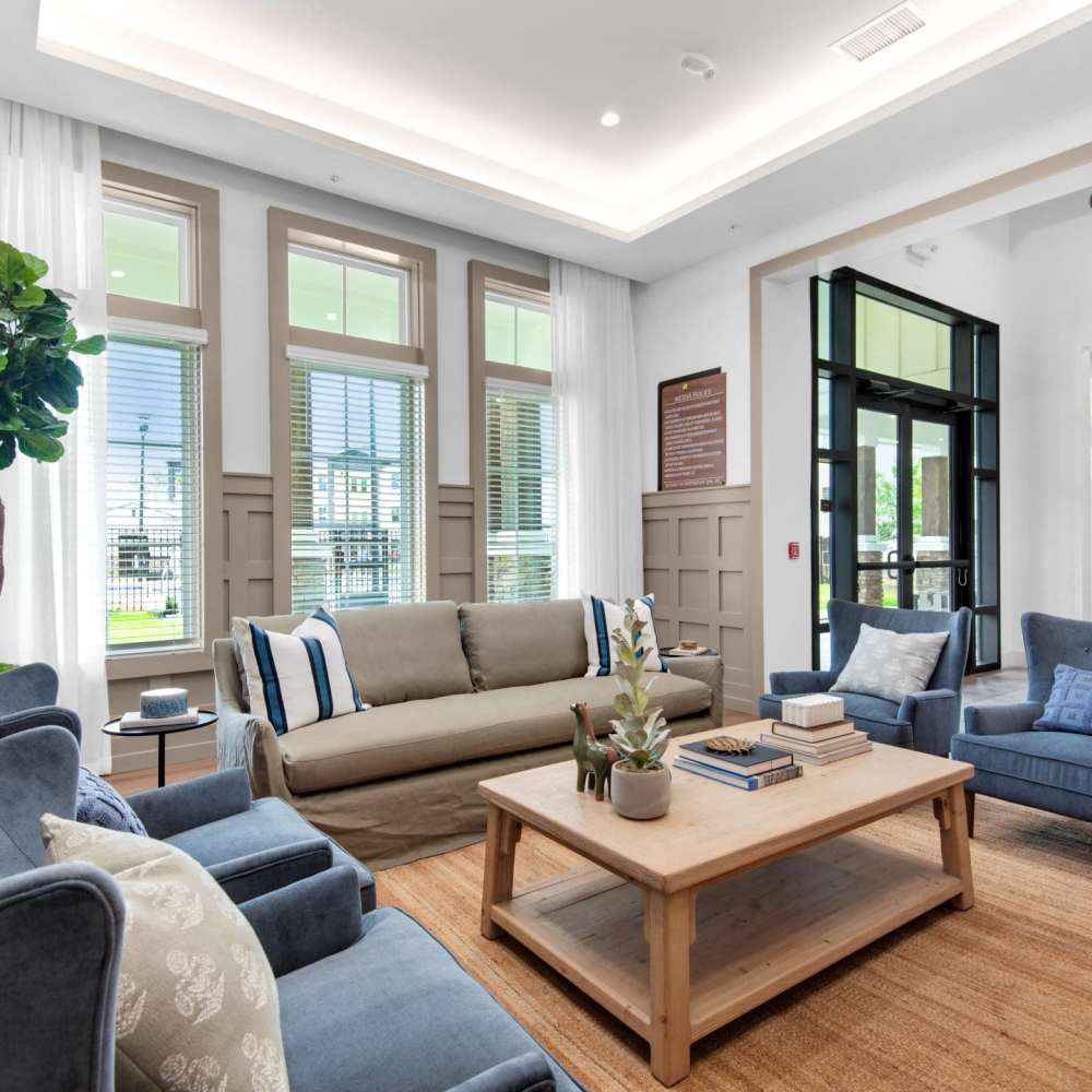 Tall ceilings and bright windows in the modern clubhouse of a Drucker + Falk property