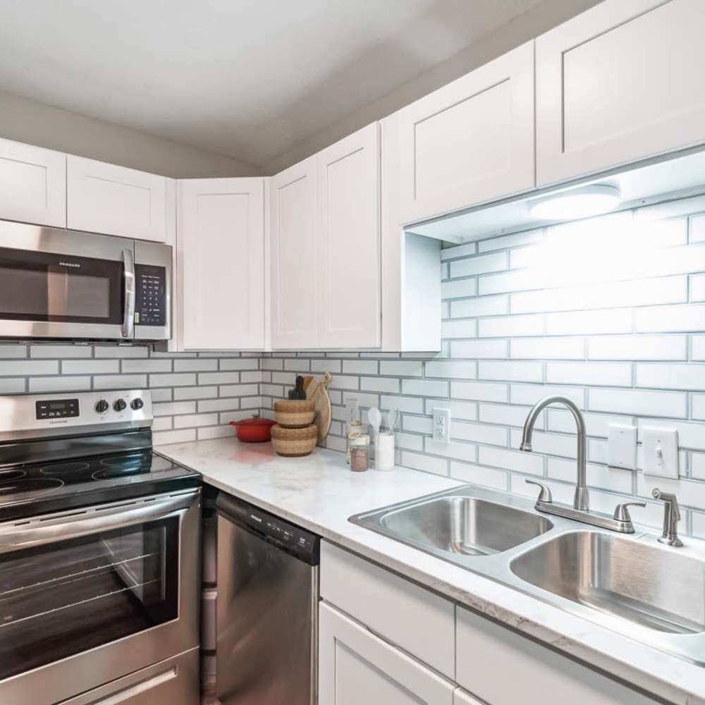 Kitchen with a tile backsplash at The Reserve At Lebanon in Lebanon, Tennessee