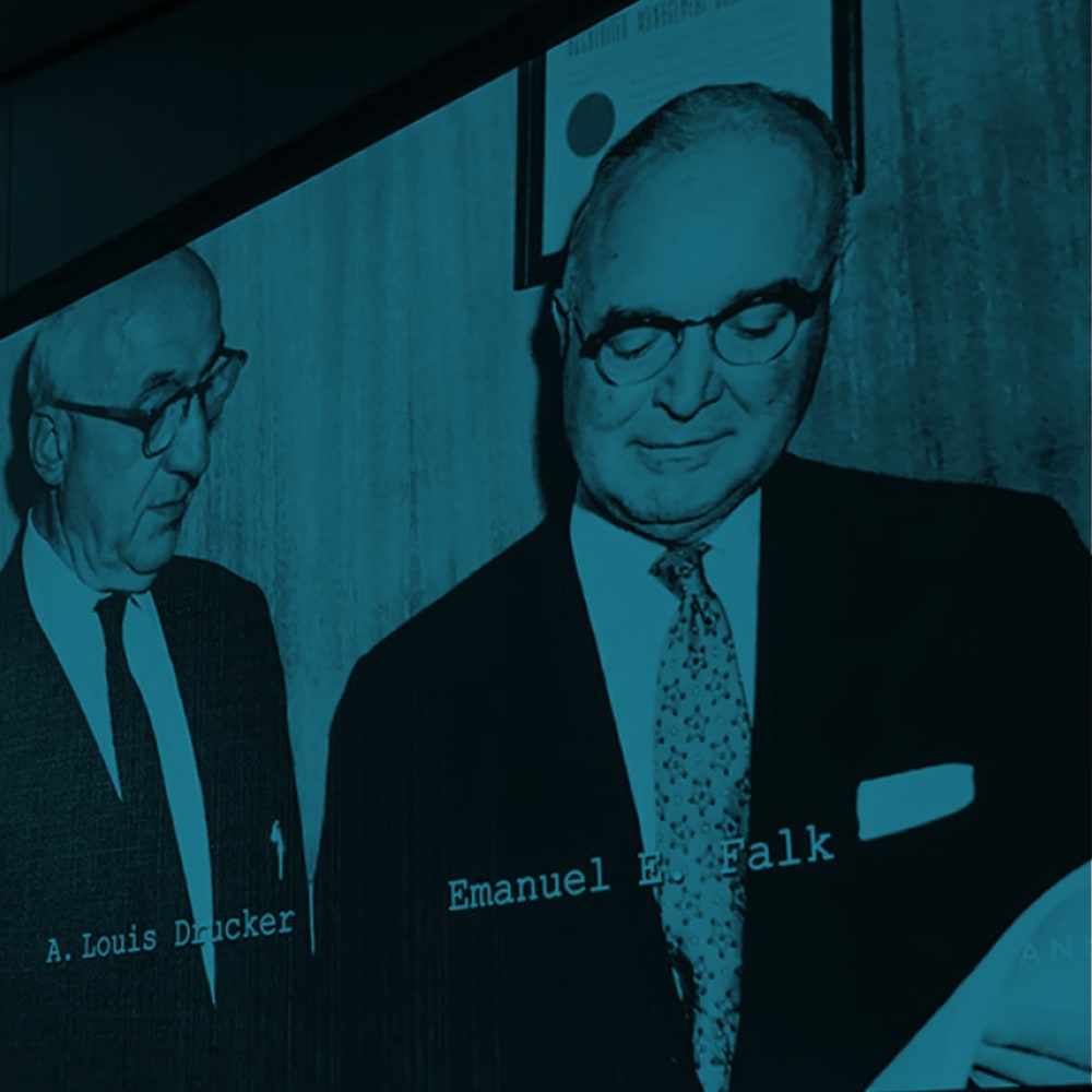 Employees in suits and ties at Drucker + Falk in Newport News, Virginia