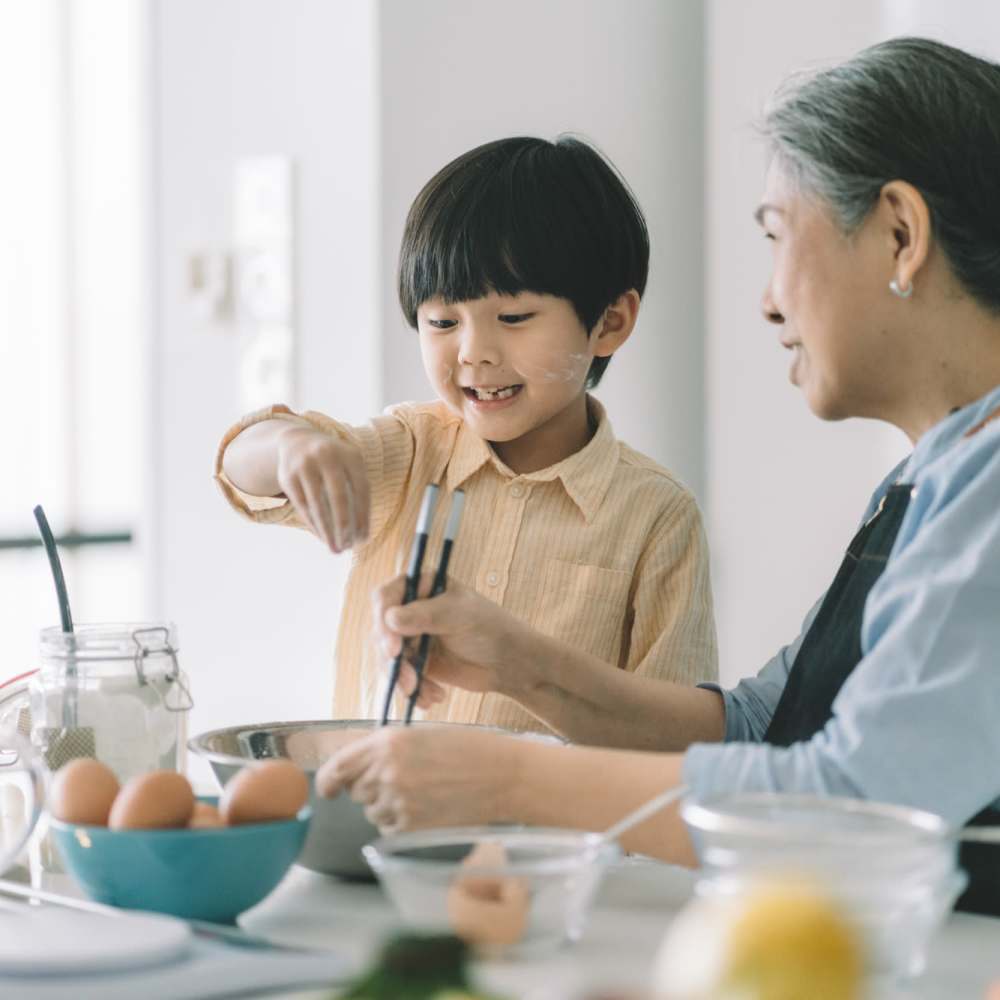 A boy helping his grandma in cooking at Marlowe Place in Charlotte,North Carolina