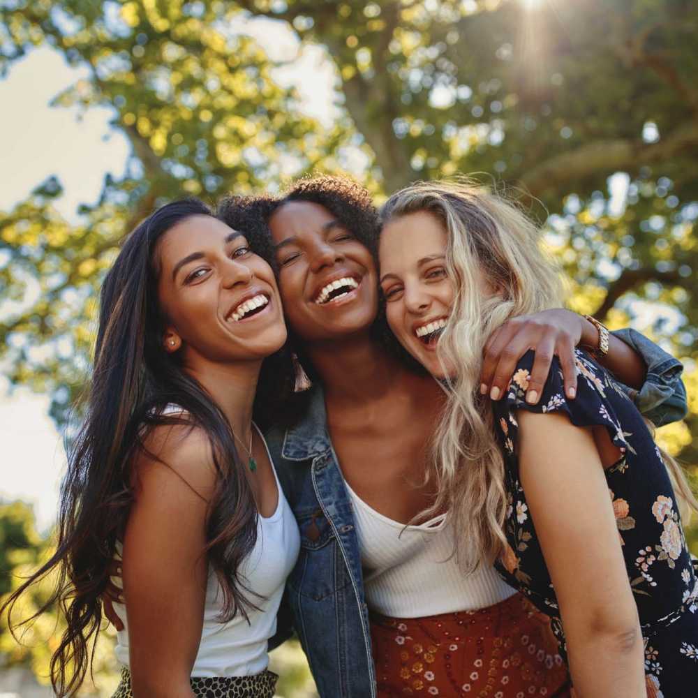 Three happy women having a good time at a park near Marlowe Place in Charlotte,North Carolina