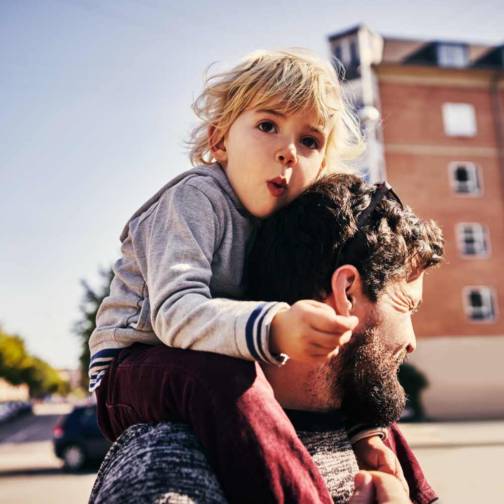 Resident and his child walking near at The Griff in Charlotte, North Carolina