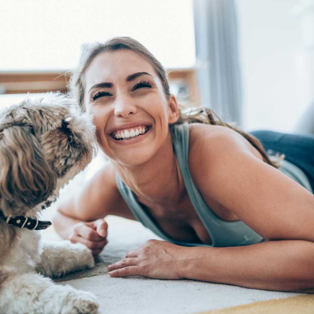 Resident with her dog at Vistas At 707 in Charlotte, North Carolina