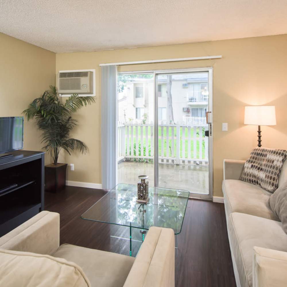 Spacious living room at Village Green Apartments in San Jose, California
