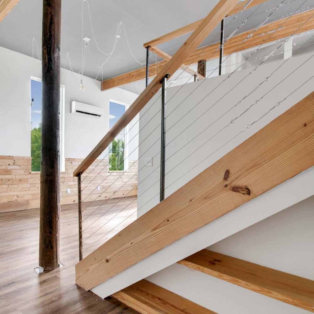 Stair in living room at The Lofts at 305 in Bryan, Texas