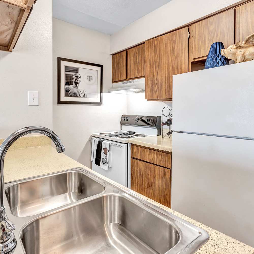 Kitchen in an apartment at The Grand 1501 in College Station, Texas