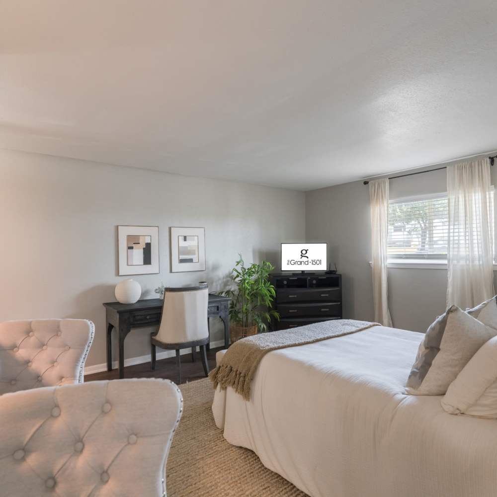 Bedroom with a comfortable bed at The Grand 1501 in College Station, Texas