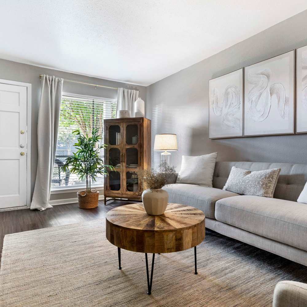 Living room with wood-style flooring at The Ivy in College Station,Texas