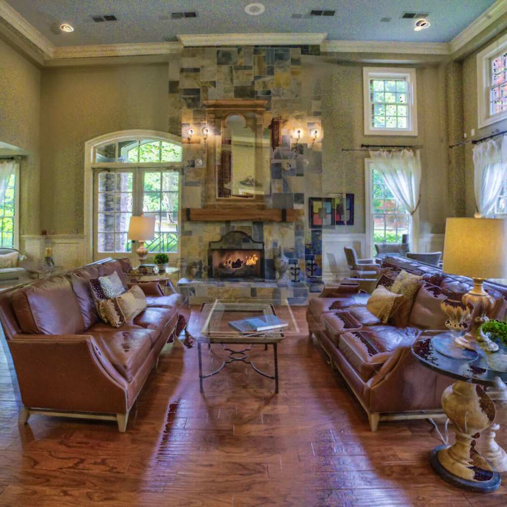 Community lounge area with fire place and seating area at Avonlea On The River in Duluth, Georgia