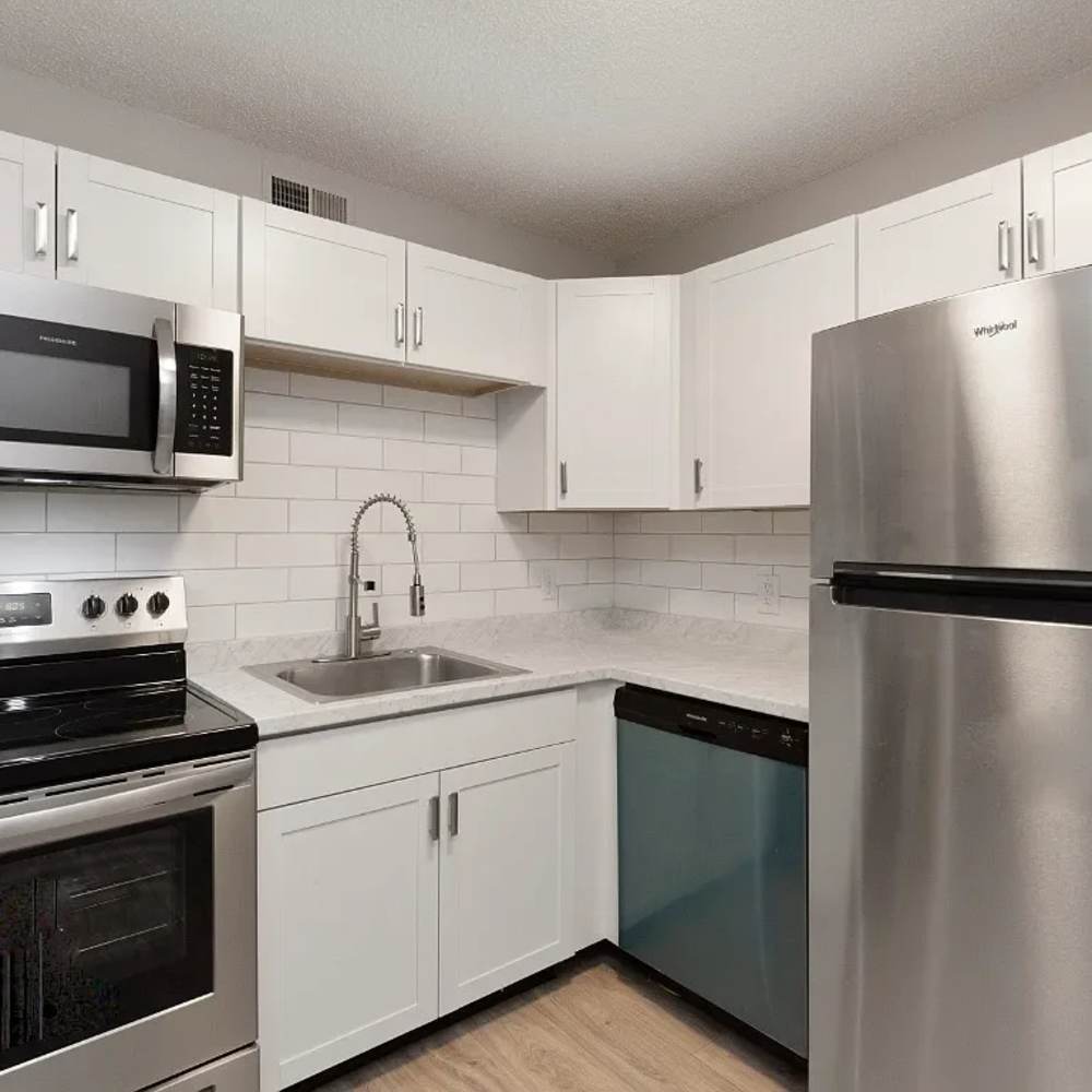 Kitchen with wooden cabinets and stainless-steel appliances at 1104 18th Ave S in Nashville, Tennessee