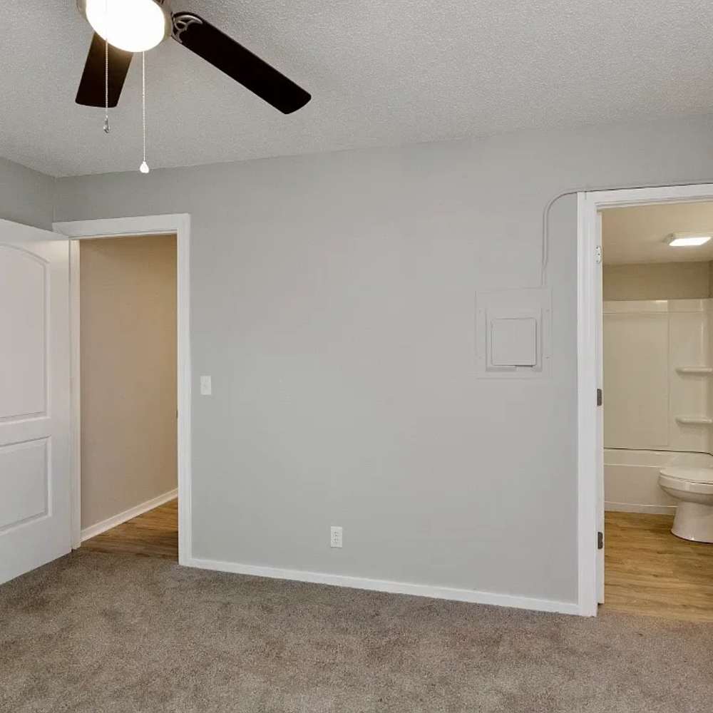 Bedroom with a ceiling fan and a door leading to the bathroom at 1104 18th Ave S in Nashville, Tennessee