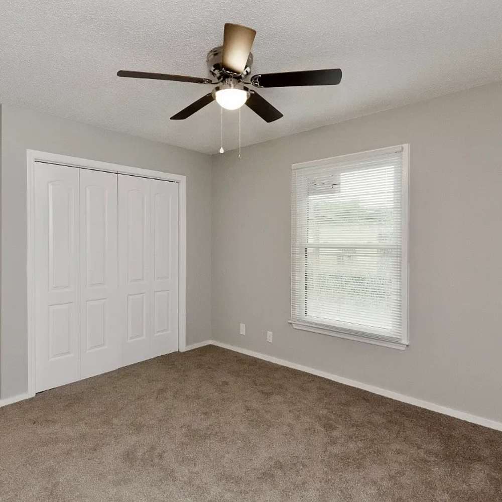 Bedroom with a large window and a ceiling fan at 1104 18th Ave S in Nashville, Tennessee