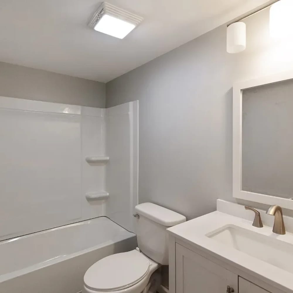 Bathroom with a toilet and a mirror at 1104 18th Ave S in Nashville, Tennessee