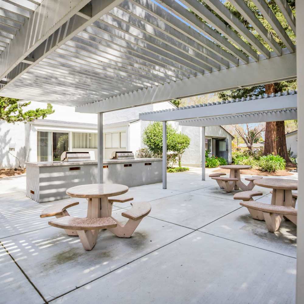 Outdoor sitting area and BBQ grills at Capitola Gardens in Capitola, California, 