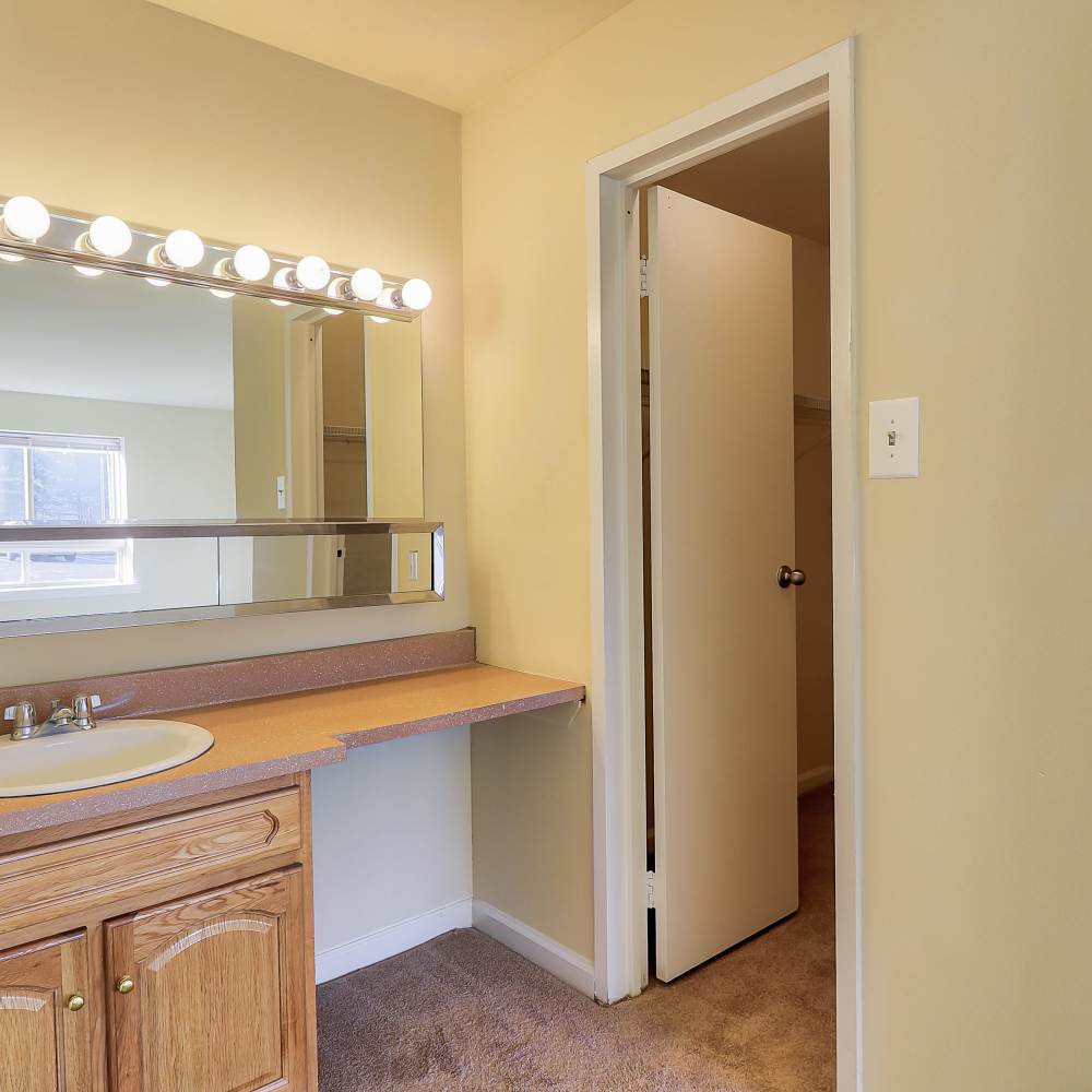 Dressing area and a door leading to the bathroom at Windham Creek in Suitland-Silver Hill, Maryland