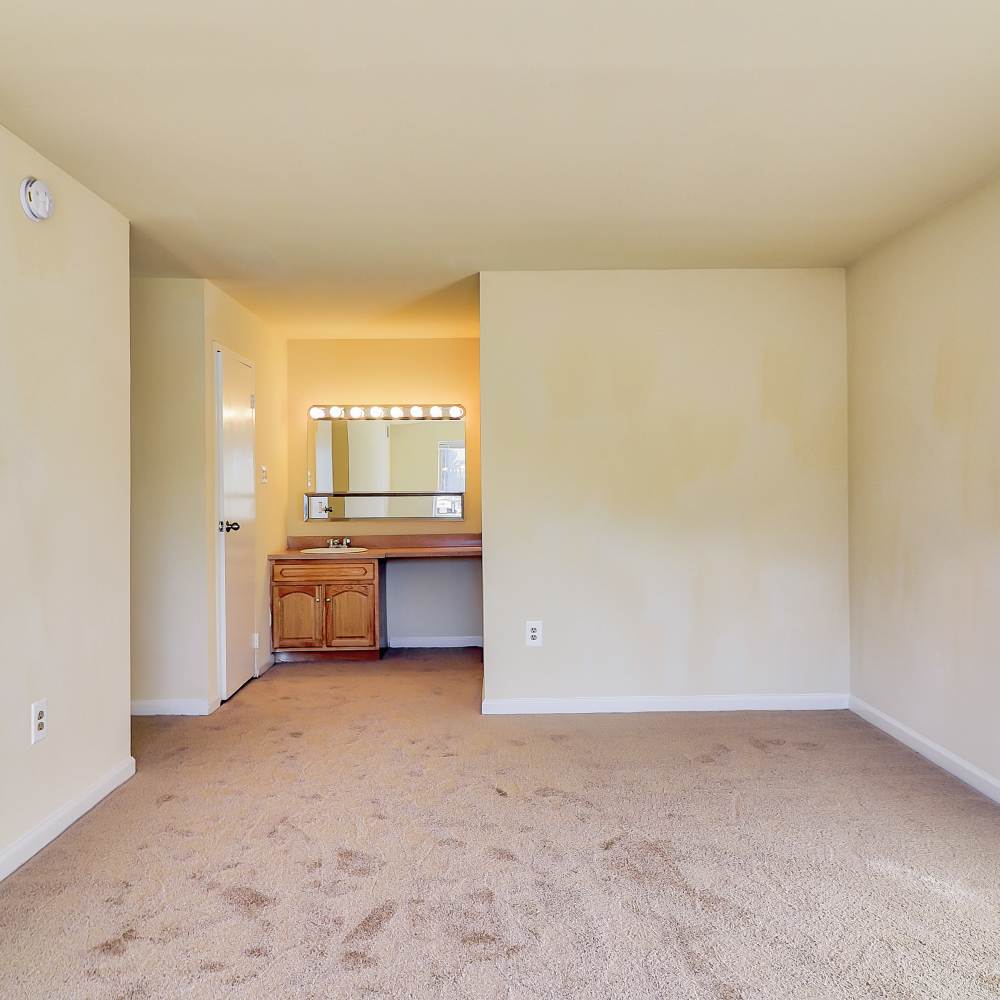 Bedroom with a dressing area with a large mirror at Windham Creek in Suitland-Silver Hill, Maryland