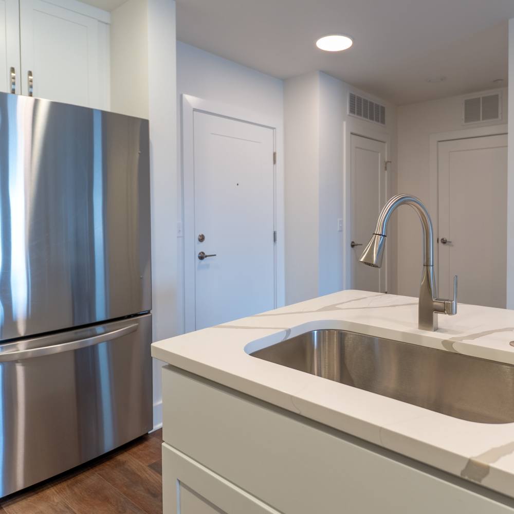 Kitchen sink and refrigerator at Gurnee Glen Apartments in Gurnee, Illinois