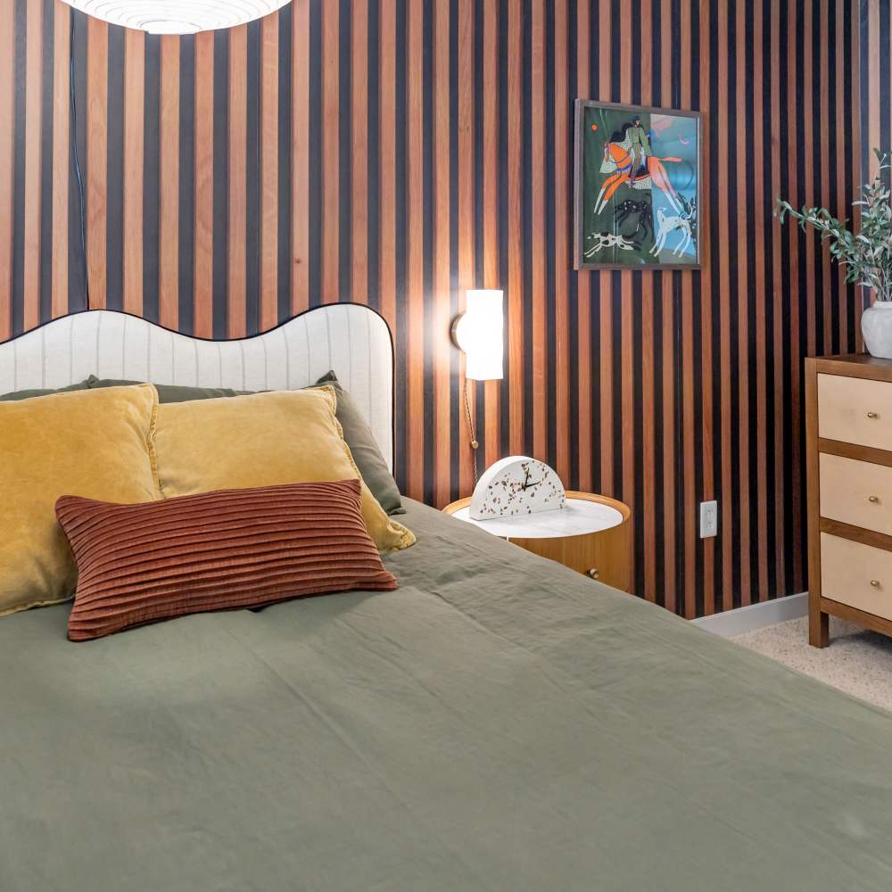 Comfortable and cozy bedroom in a model home at Nova Apartment Homes in San Diego, California