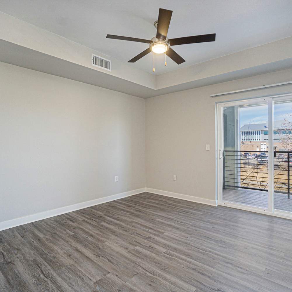 Living room with vinyl flooring and ceiling fan