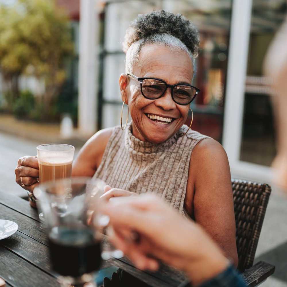 Residents smiling while seating on the couch at Whitetail Ridge in Salem, Wisconsin