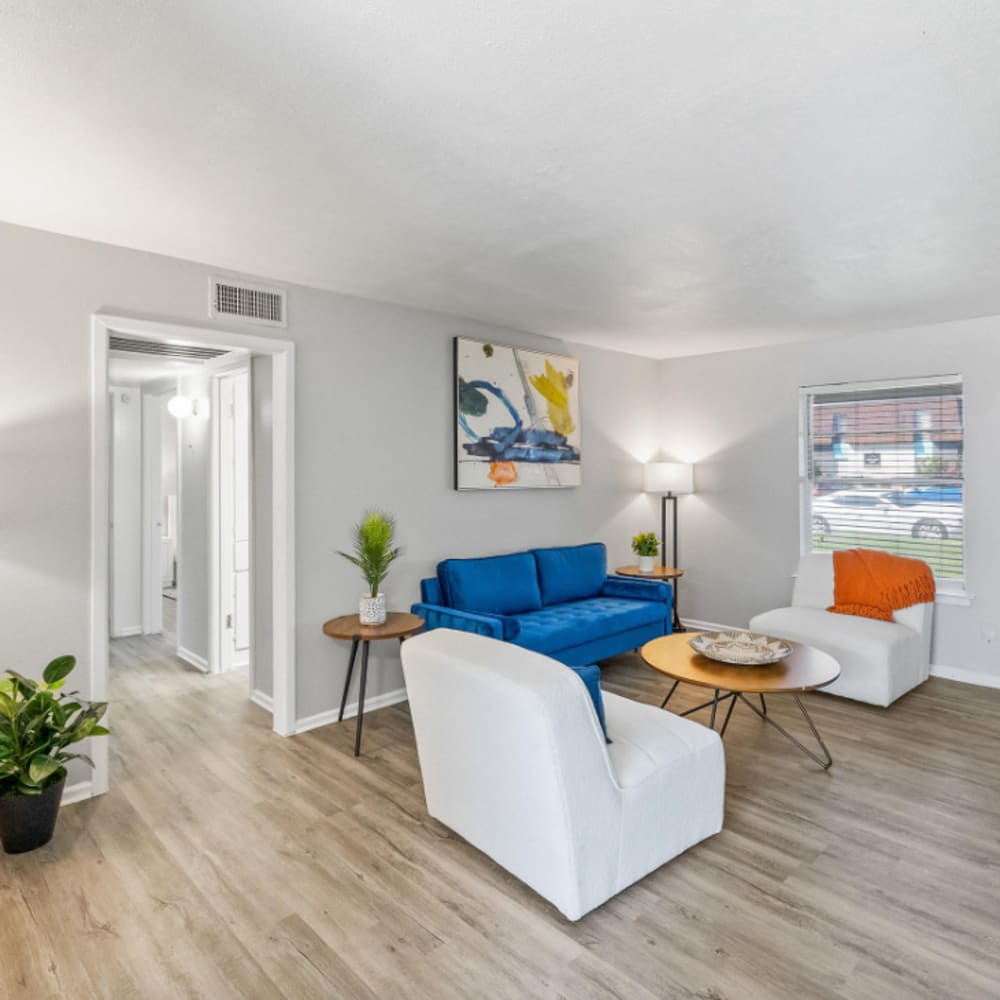Spacious living room with white furniture at The Hayes Apartments in Fort Worth,Texas