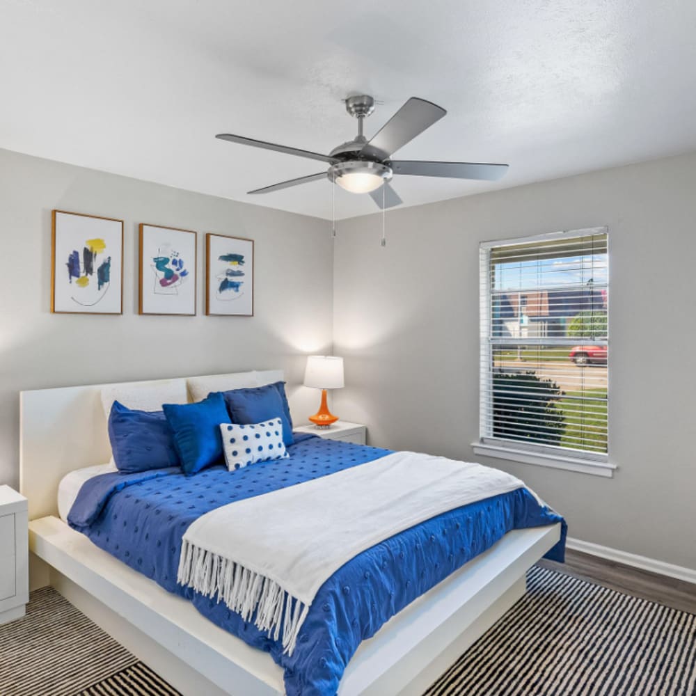Bright bedroom with a window at The Hayes Apartments in Fort Worth,Texas