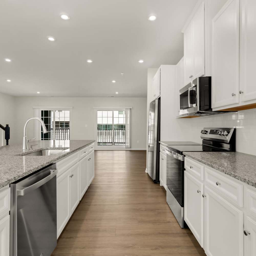Kitchen area with modern  appliances and kitchen island at Dorsey Overlook in Ellicott City, Maryland