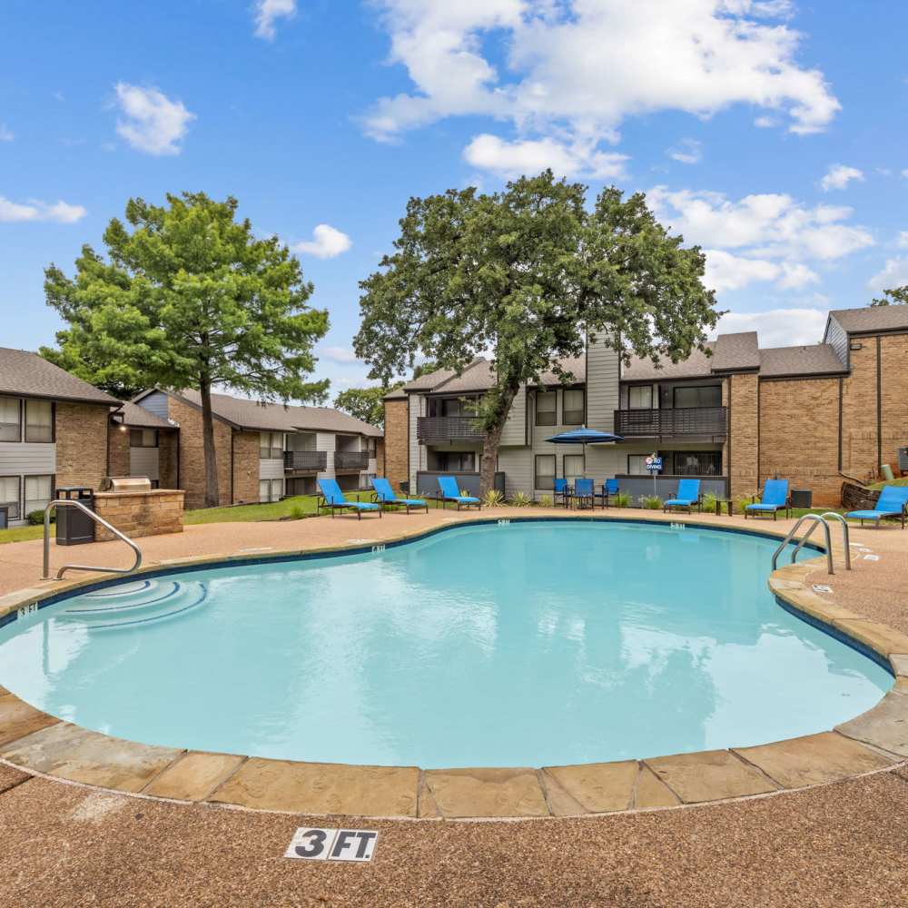 Swimming pool with chairs at The Madeleine in Fort Worth, Texas