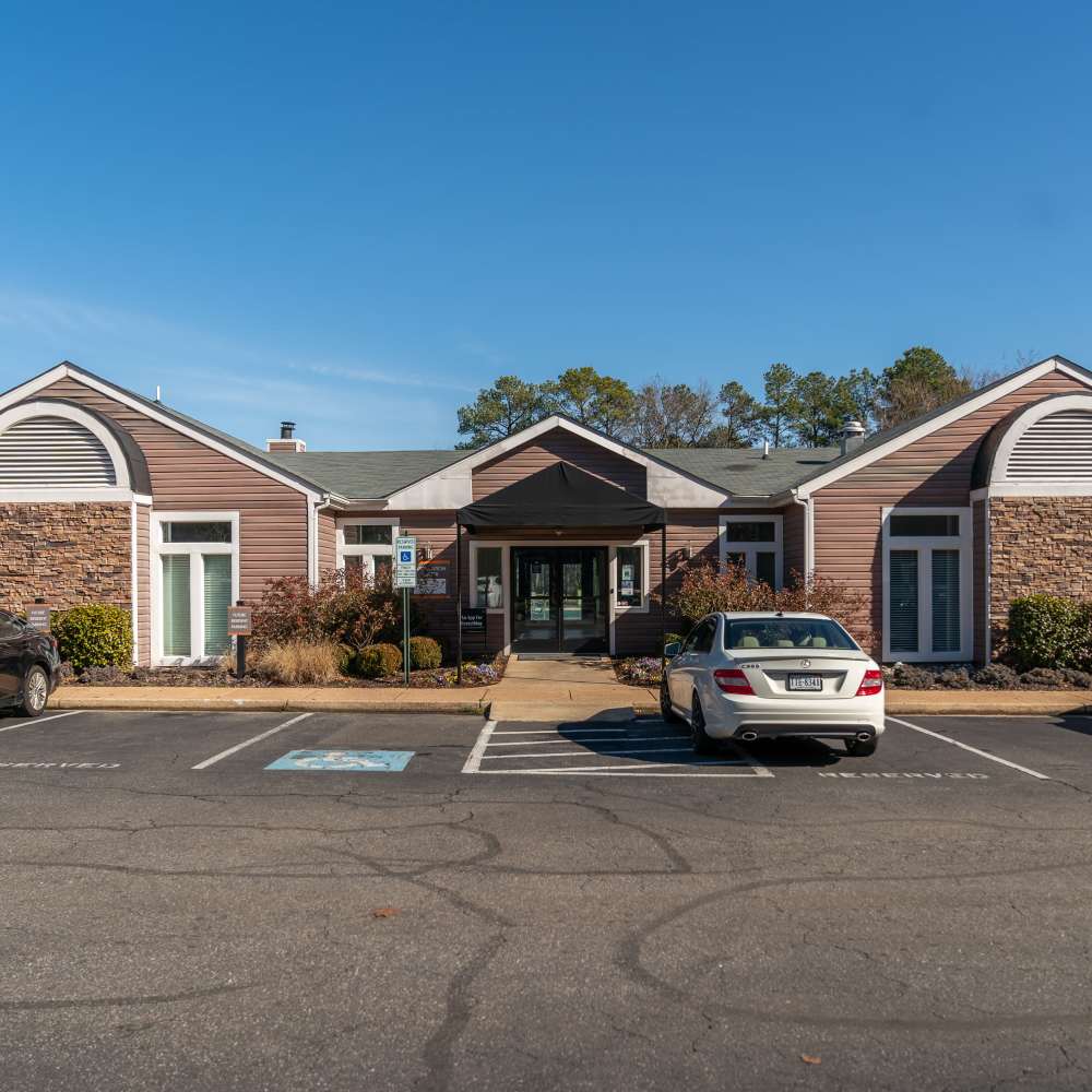 Exterior view of the building with car parked at Reserve South in Richmond, Virginia