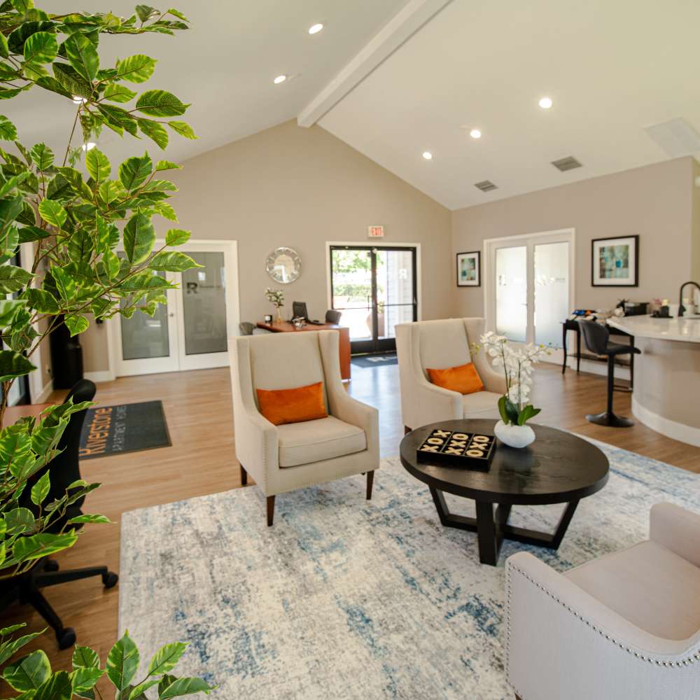 Welcoming reception area at Riverstone Apartment Homes, showcasing stylish seating and a view of the front desk at Riverstone Apartments in Sacramento, California