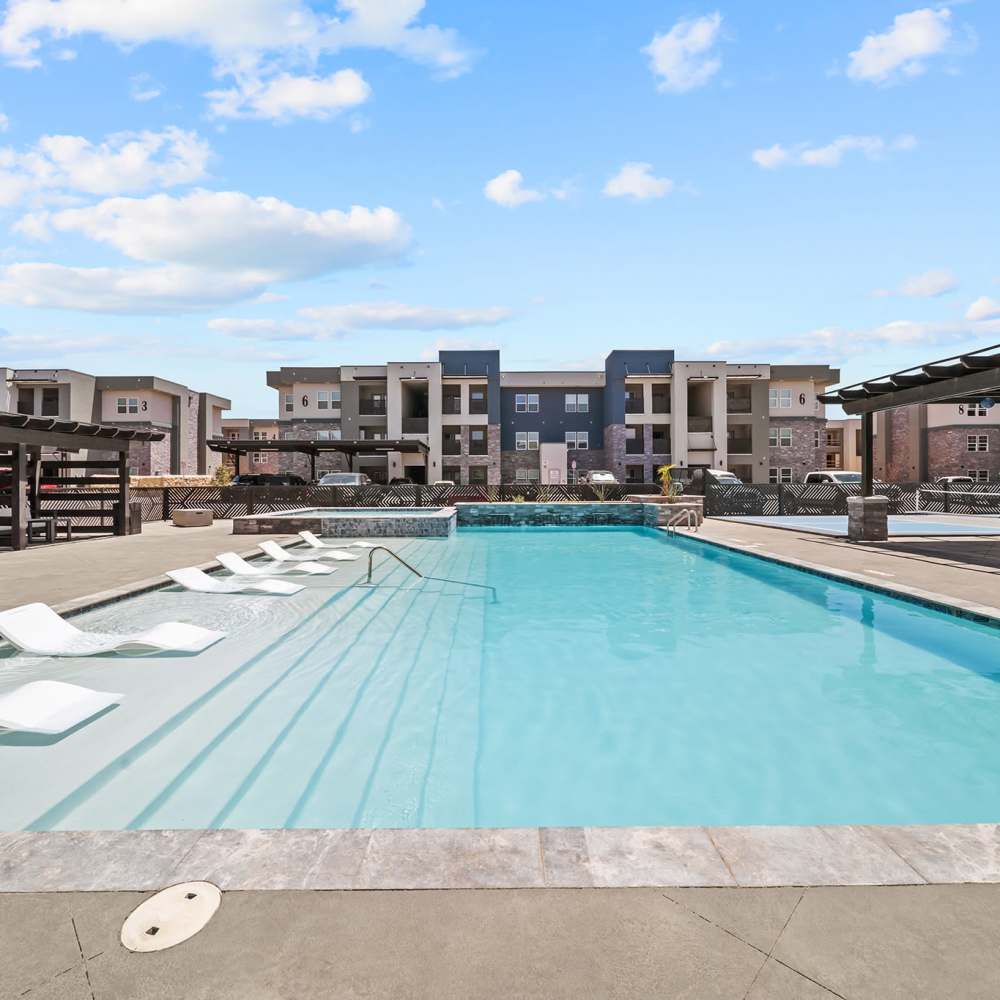 Sparkling pool water with sun decks at Retreat at Eastlake in El Paso, Texas