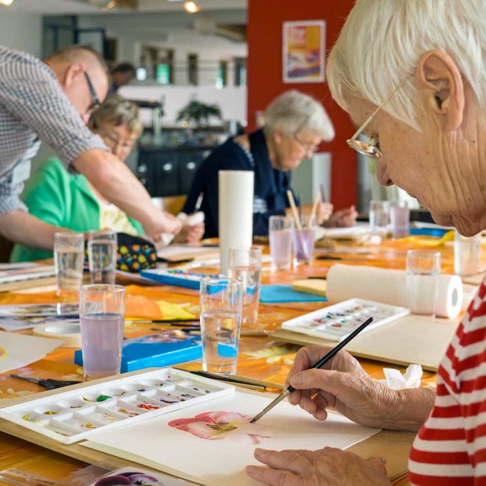 Senior resident doing painting at Union Court Senior Apartments and Townhomes in Kenosha, Wisconsin