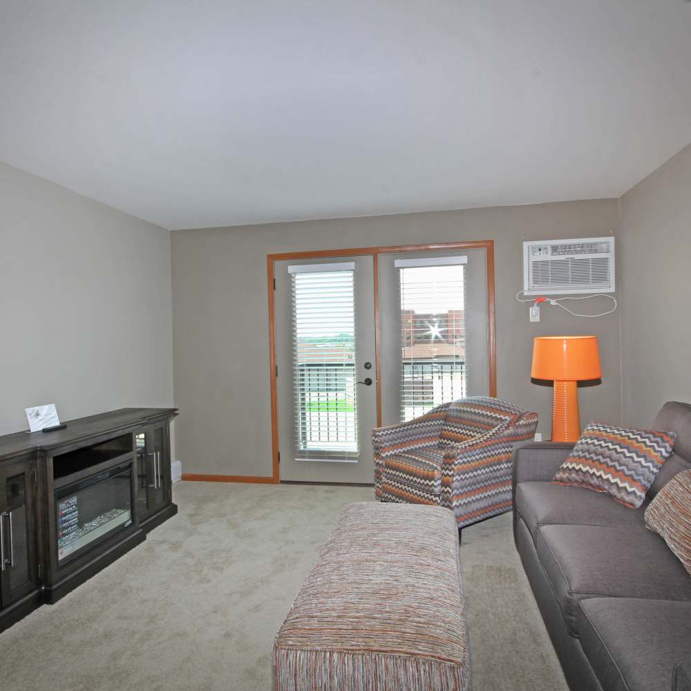 Living room with attached patio at Parkview East in Ramsey, Minnesota