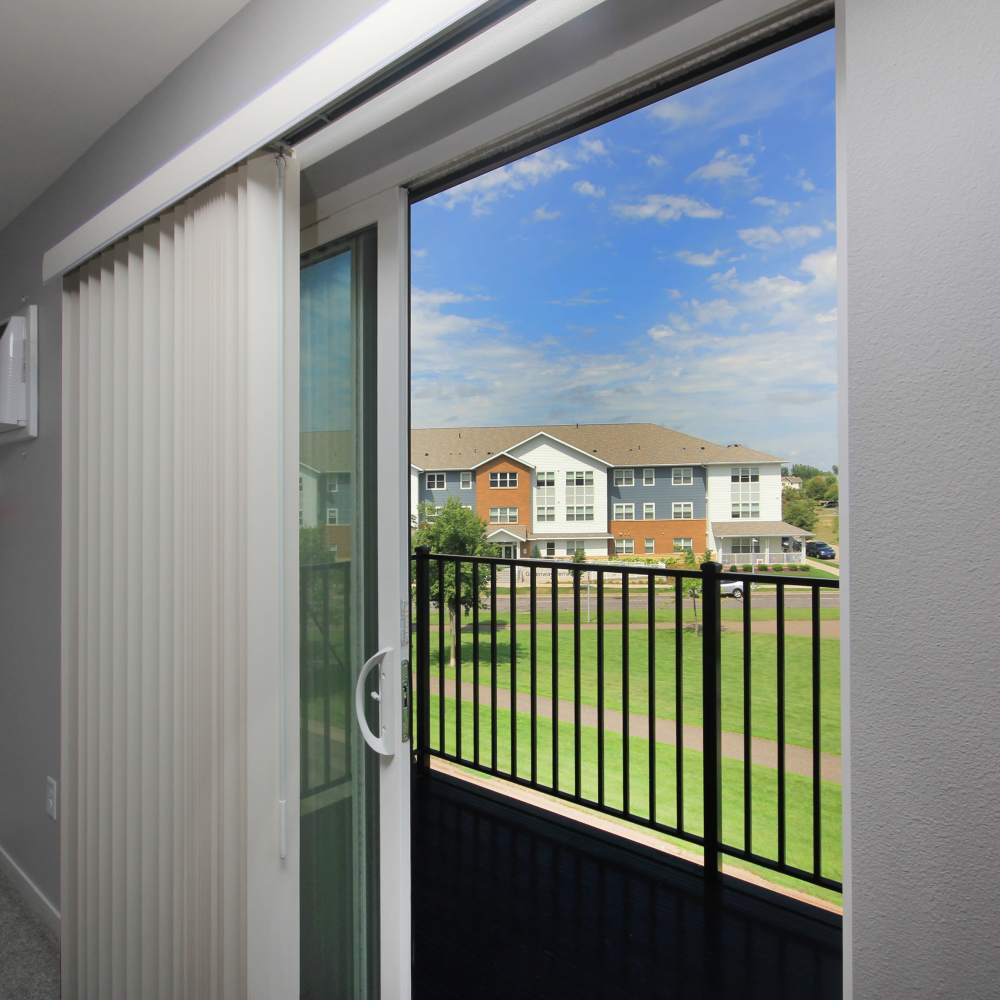 Sliding door leading to the balcony at Sapphire Apartments in Ramsey, Minnesota