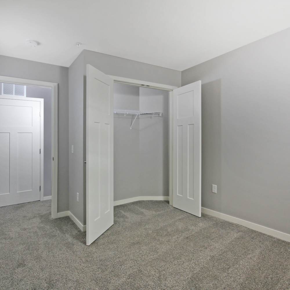 Bedroom with a walk-in closet at Sapphire Apartments in Ramsey, Minnesota