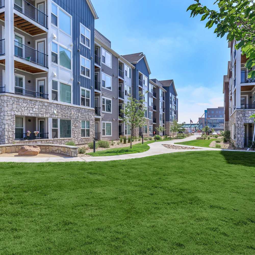 Property complex with a lawn at Clear Creek Crossing in Wheat Ridge,Colorado