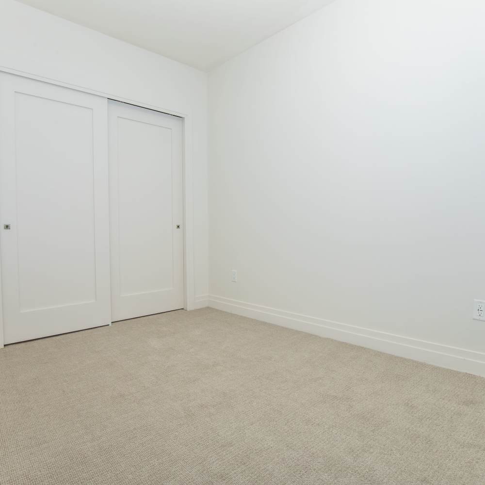 Bedroom with walk-in closet at The View at Wash Park in Denver, Colorado