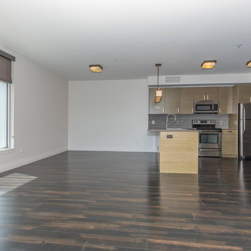 Spacious living room with hard-wood flooring at The View at Wash Park in Denver, Colorado