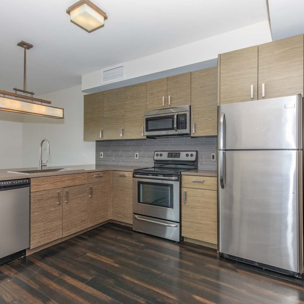 Modern kitchen with refrigerator at The View at Wash Park in Denver, Colorado
