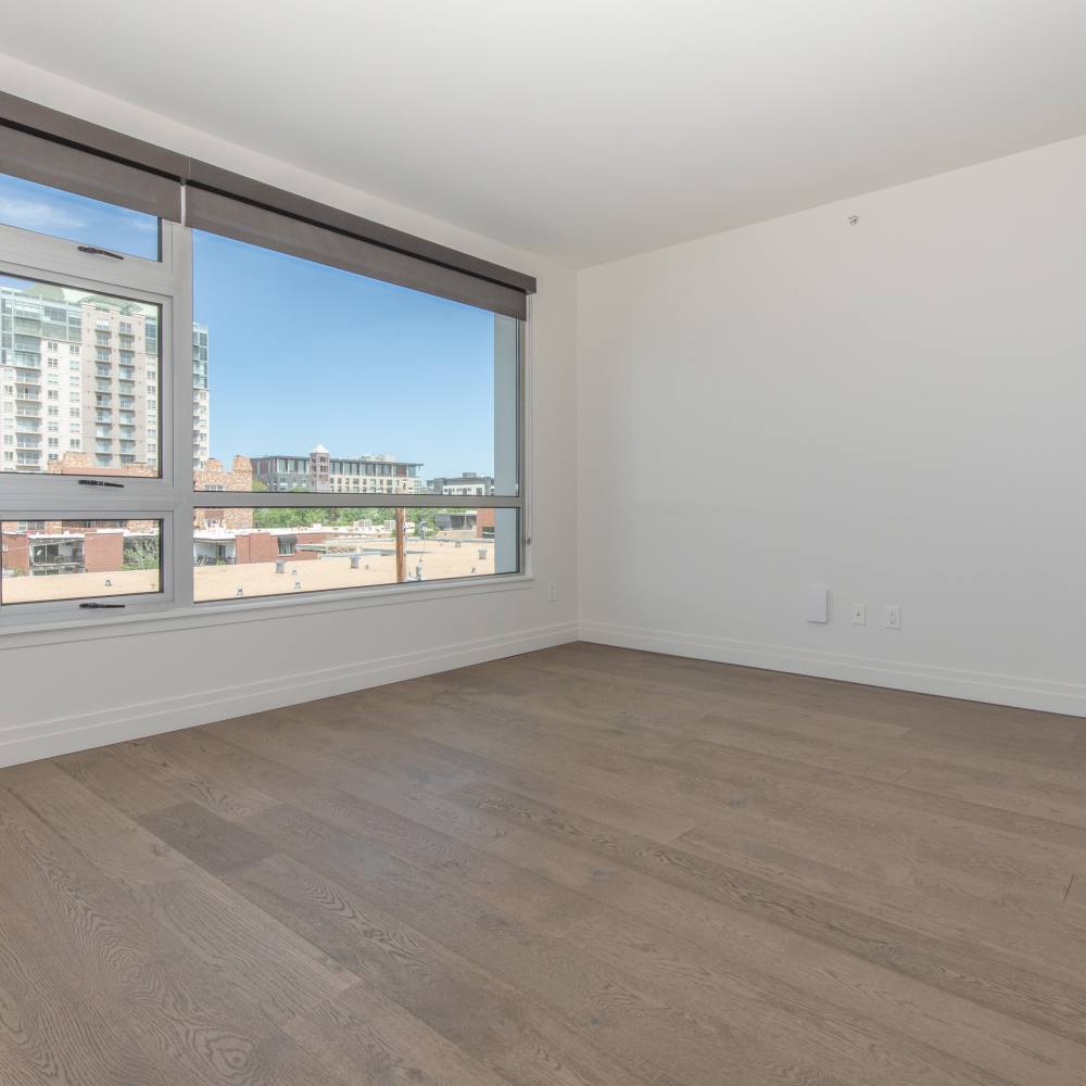 Bedroom with a large window at The View at Wash Park in Denver, Colorado