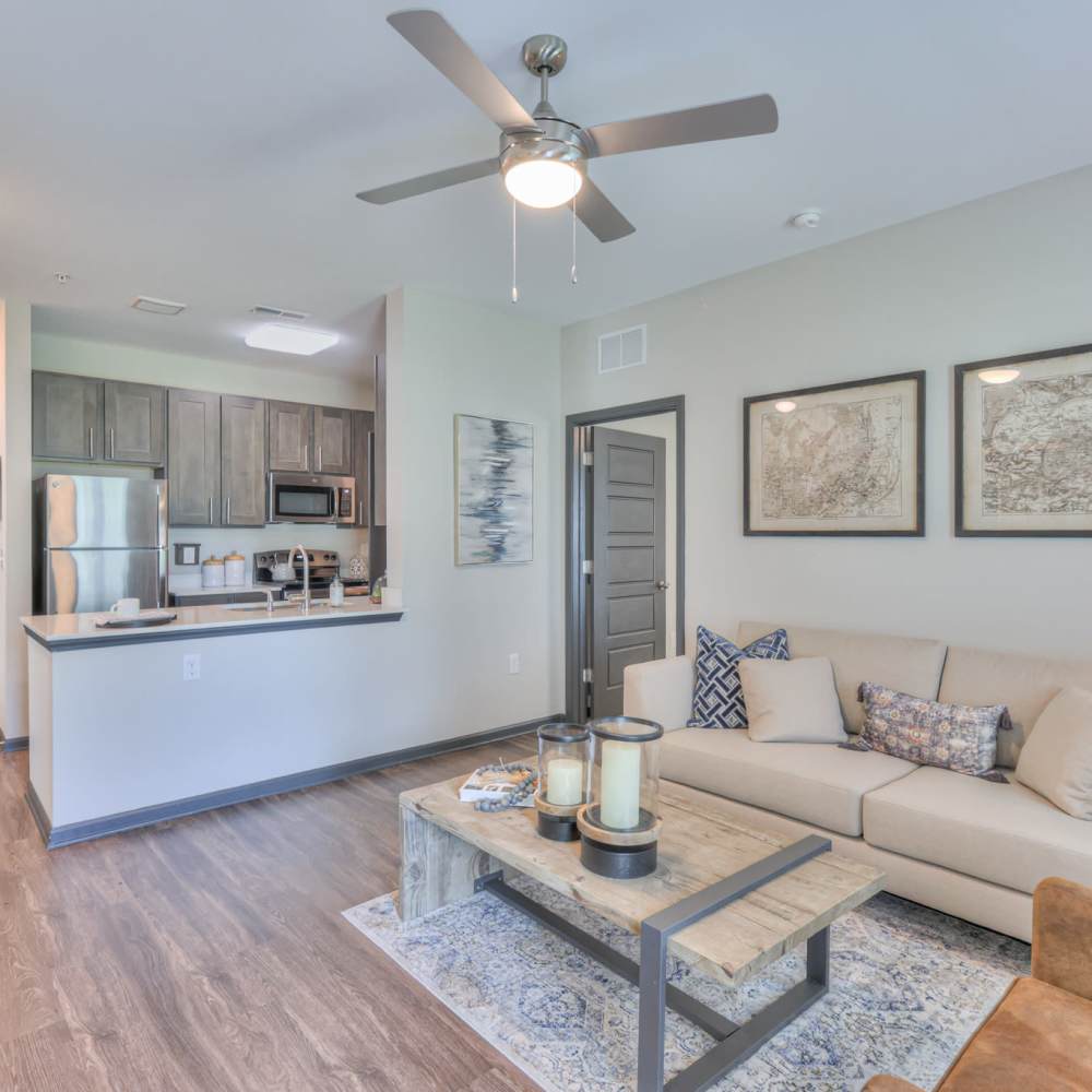 Living room with beautiful wall art at Anthem at Creekside in Smyrna, Tennessee