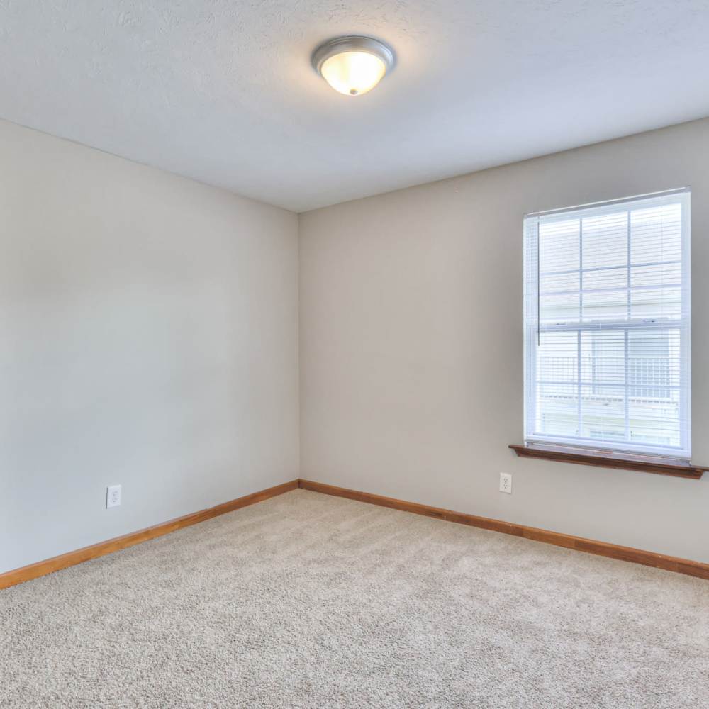 Unfurnished bedroom with a window at Laurel Woods Apartments in Smyrna,Tennessee