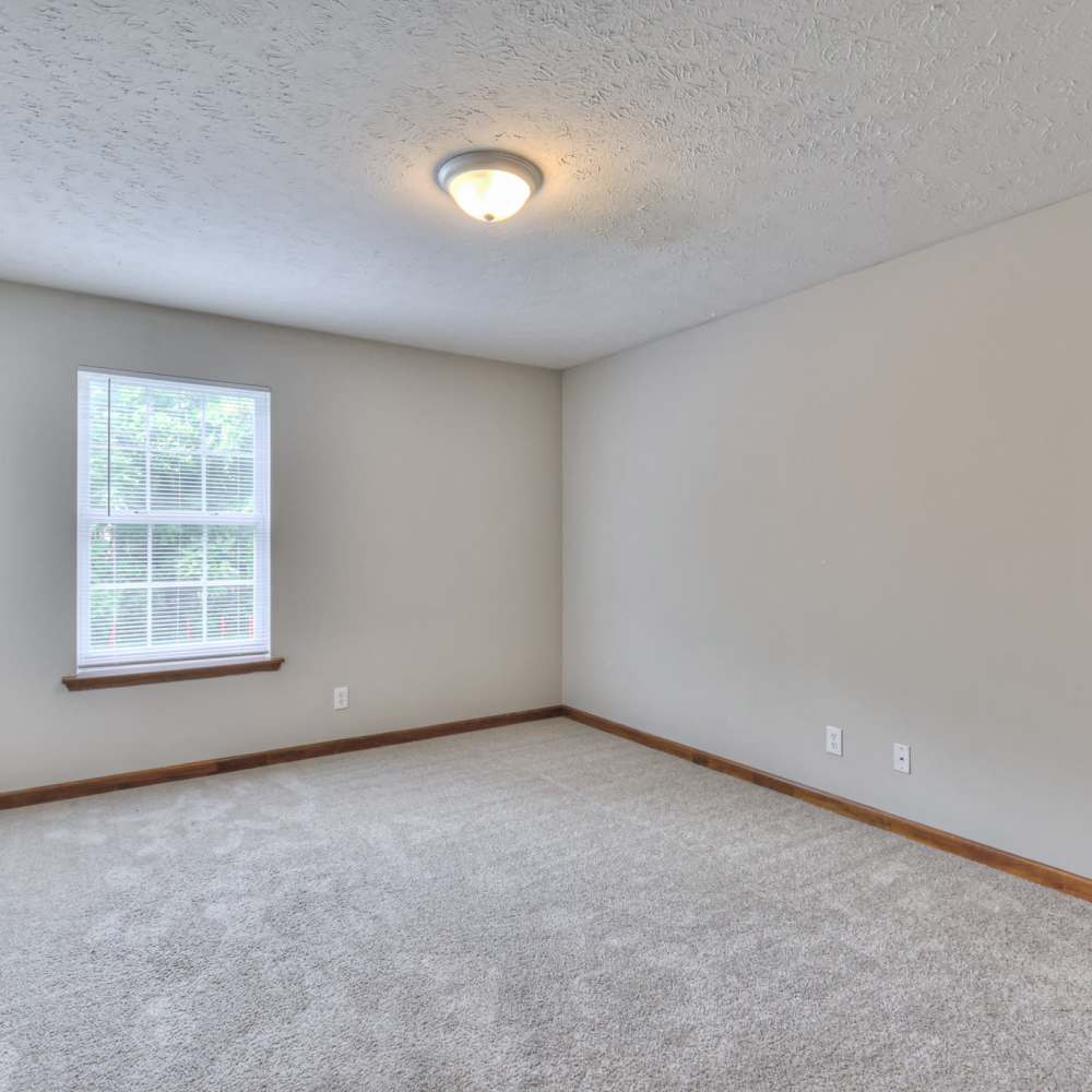 Bedroom with carpet flooring at Laurel Woods Apartments in Smyrna,Tennessee