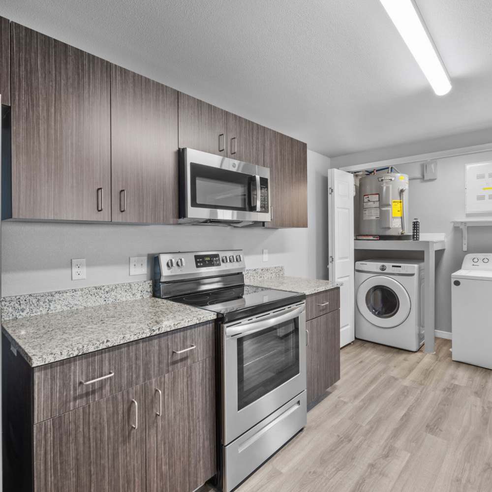 Kitchen with attached laundry area at District At Pellicano in El Paso, Texas