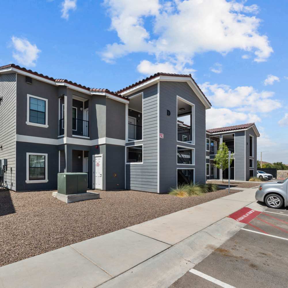 Building exterior view with parking at District At Pellicano in El Paso, Texas
