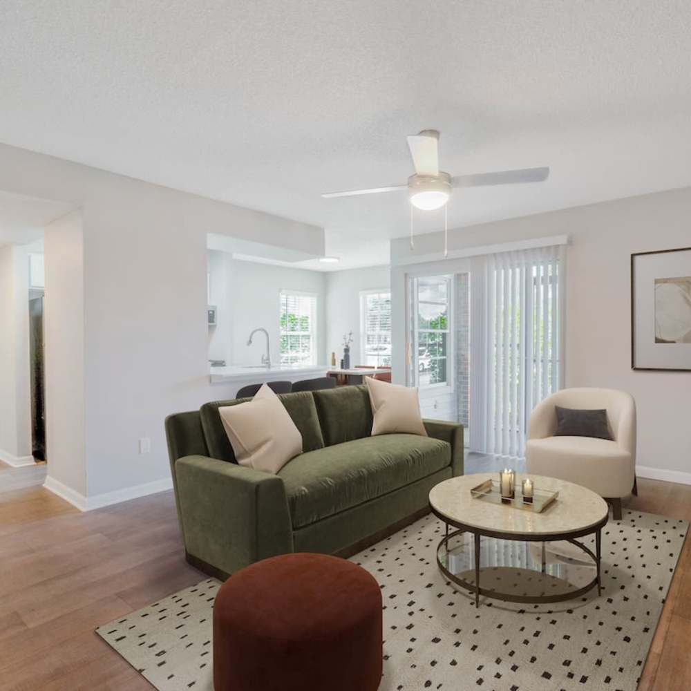 Living Room in open concept apartment with large windows and high ceilings
