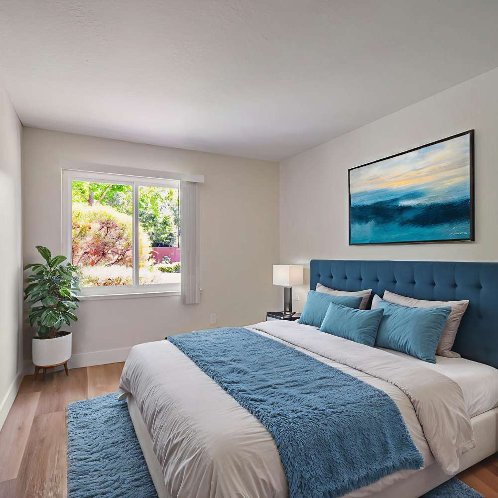 Well-lit apartment bedroom at Country Club Village in Rohnert Park, California