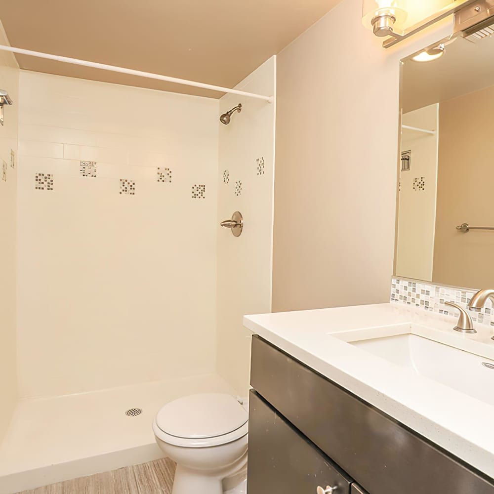 Bathroom with a bathtub at Wellshire Apartments in Denver,Colorado